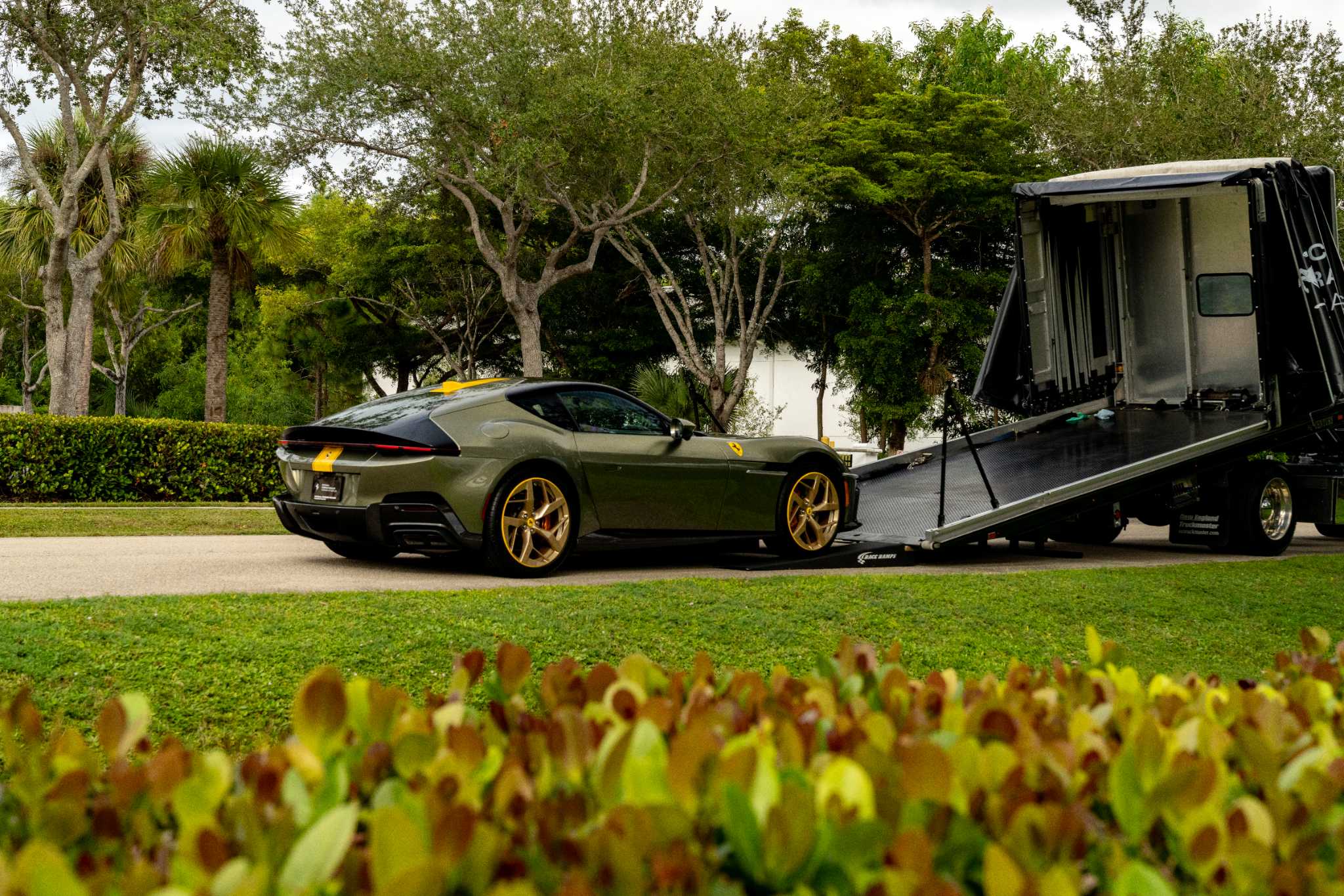 Enclosed transport trailer used for concierge vehicle pickup and delivery