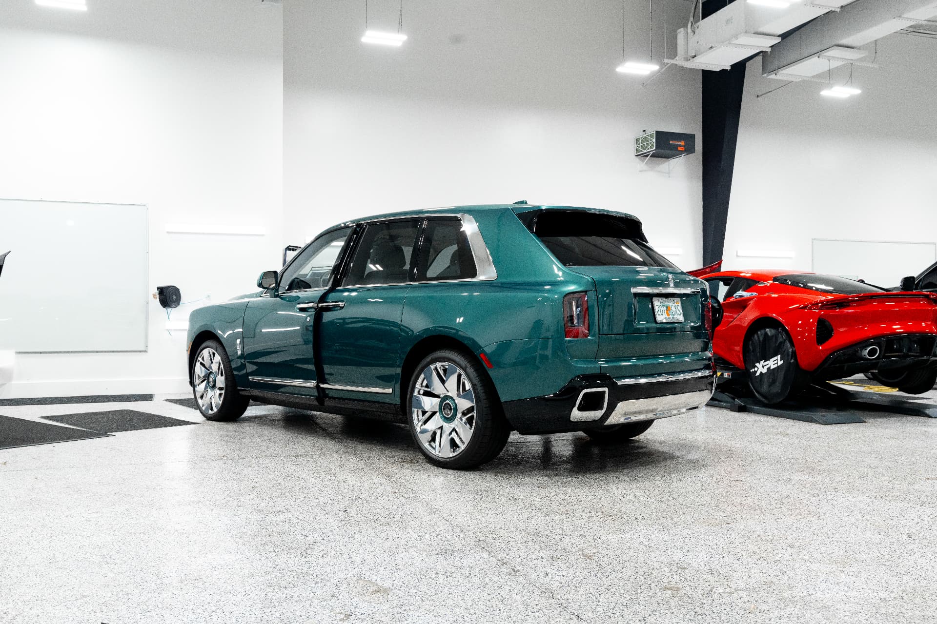 Green Rolls Royce Cullinan in the Detailers of Naples studio